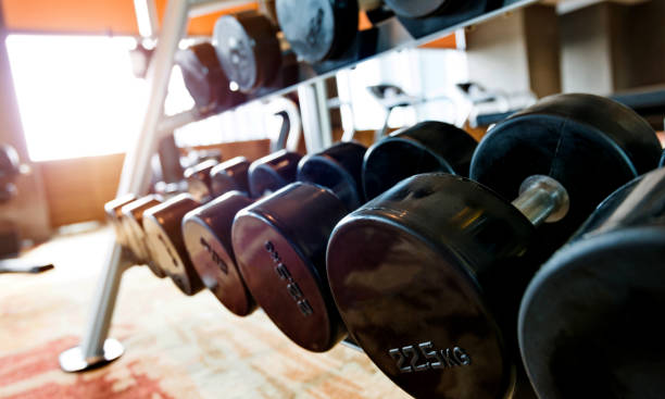 istock Dumbbells on the rack at gym 908668540
