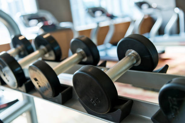 istock Dumbbells in a row at gym 908670732