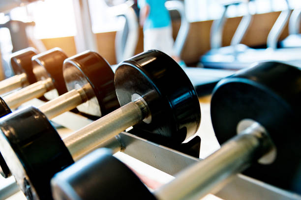 istock Dumbbells in a row at gym 908670844