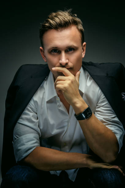 istock Man in white shirt and black jacket. 908670868