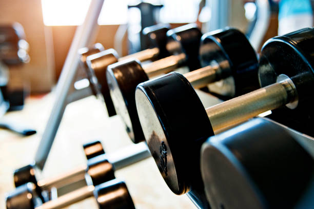 istock Dumbbells in a row at gym 908670956