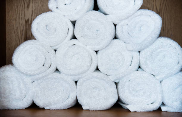 istock White towels in the shelf 908671634