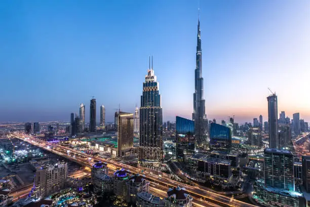 Blue hour view of Dubai Downtown architecture after winter sunset. Dubai, United Arab Emirates.