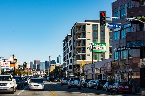 Los Angeles, California,USA - January 20, 2018 : Korea Town street in Los Angeles  California. Los Angeles has the most korean population in USA and known for its ethnic food and culture . Downtown Los Angeles skyscrapers can be seen in the background.