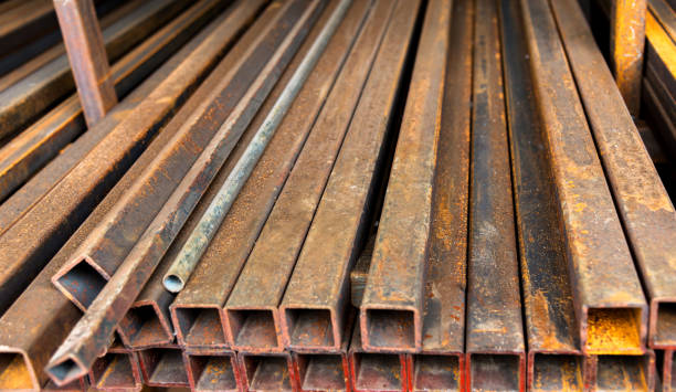 istock Rusty square steel tubes on the shelf 908683404