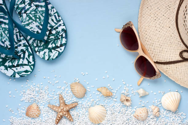 istock Beach items with  sunglasses  on wooden background 908685912