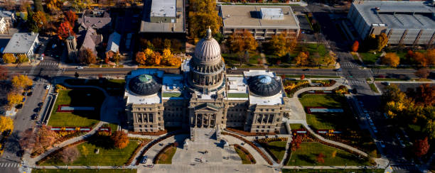 istock Aerial front view of the Idaho State Capital building with fall colored trees 908689734
