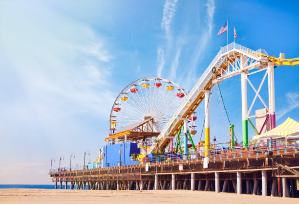 Santa Monica Pier in California a view of Santa Monica beach and pier from the beach santa monica stock pictures, royalty-free photos & images
