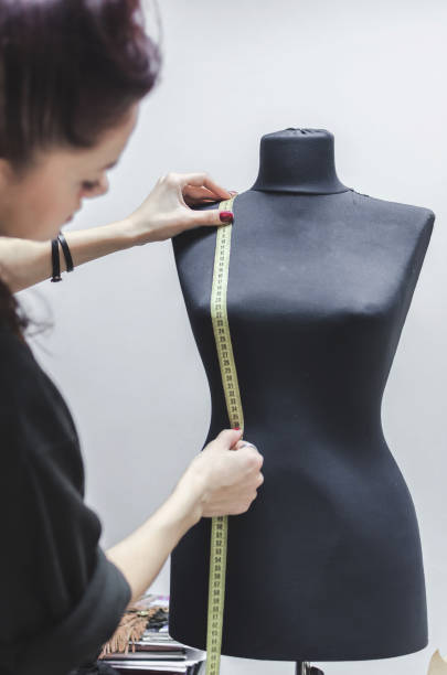 istock Black women sewing mannequin 908693234