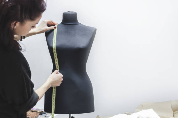 istock Black women sewing mannequin 908693246