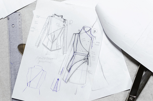 drawing sketches on paper, fashion designer concept, scissors