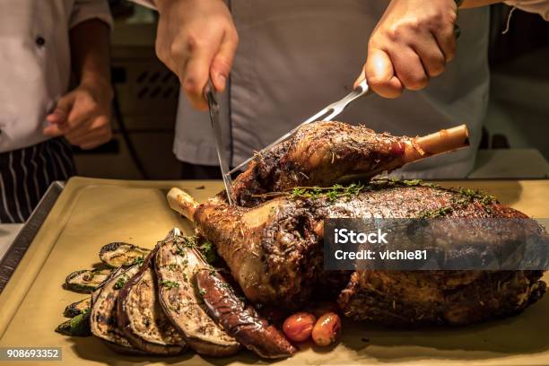 Carving Lamb Stock Photo - Download Image Now - Baked, Banquet, Barbecue Grill
