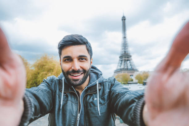 istock Young man taking selfie with smartphone 908695884