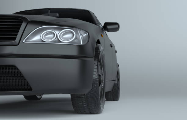 istock Close up of car on gray studio background 908696188