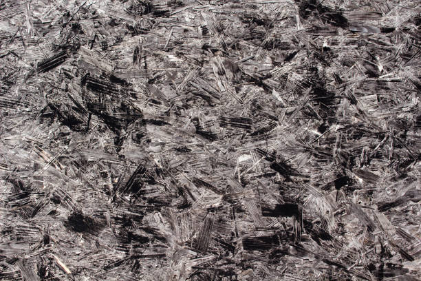istock Closeup image showing the texture of chipboard painted black 908696992