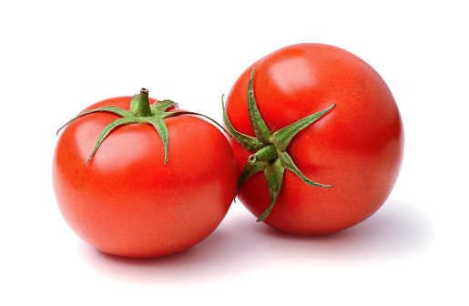 Ripe tomatoes isolated on white background