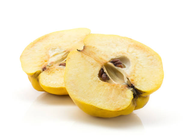 istock Fresh raw quince isolated on white 908702702