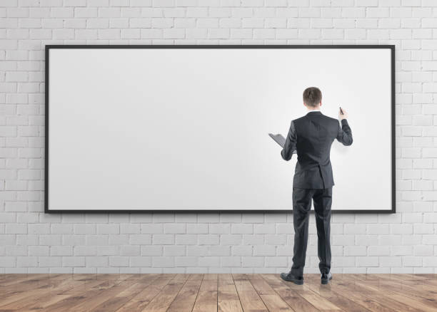 istock Businessman with a marker, whiteboard 908707804