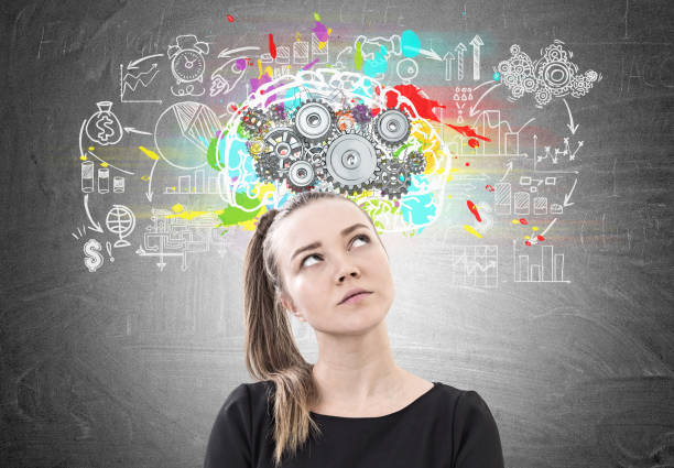 istock Pensive woman with a ponytail, brain cogs 908708134