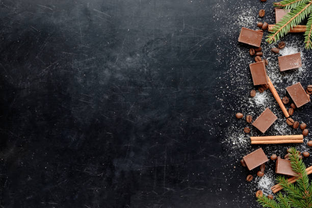 istock coffee with chocolate shugar and cinnamon in christmas style black background flat view copy space 908708242