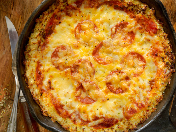 istock Cauliflower Crust Skillet Pizza with Gluten Free Pepperoni 908708562