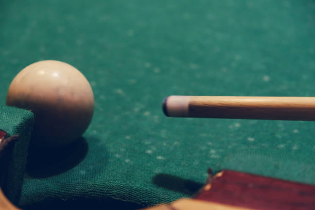 istock Billiard stick cue ready to shot ball close up 908711140