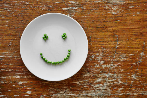 istock happy smiley face out of peas 908713916