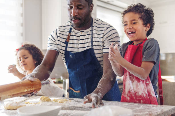 istock Father cooking with kids 908713936