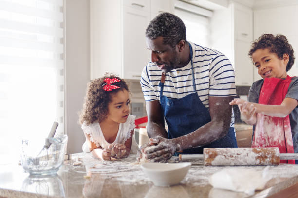 istock Father cooking with kids 908714060