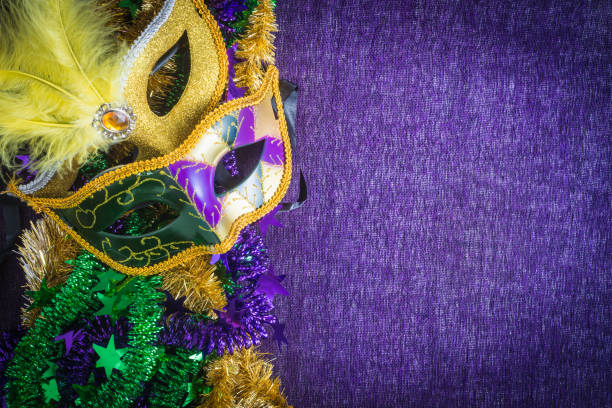 Mardi Gras, venetian carnival mask on a purple background Mardi Gras, venetian carnival mask on a purple background evening ball stock pictures, royalty-free photos & images