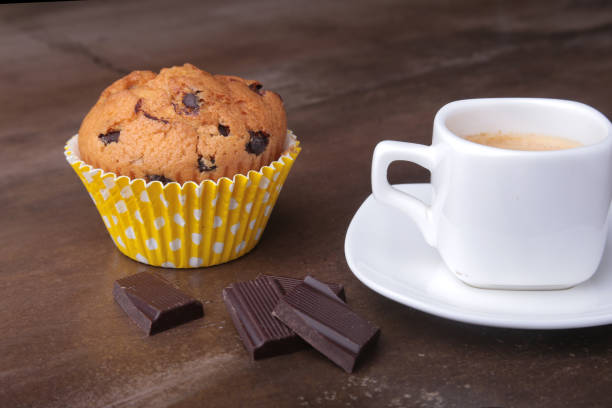 istock Homemade muffin with raisins and cup classic espresso coffee. selective focus. 908714772