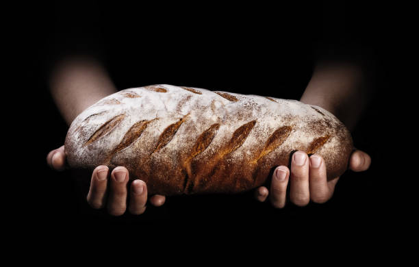 Freshly baked bread on a black background.