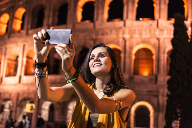 istock Smiling girl with phone 908726152