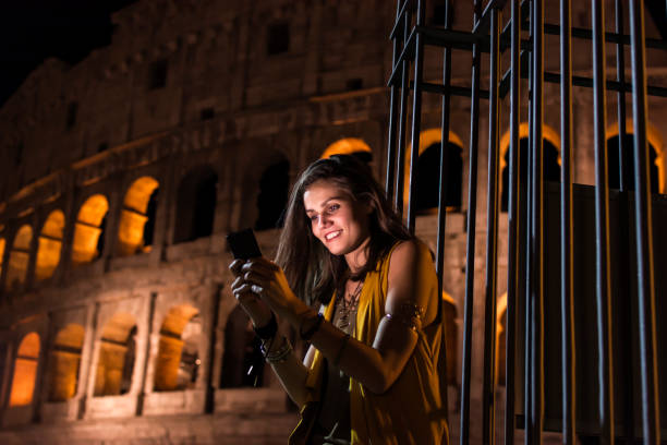 istock Smiling girl with phone 908726154