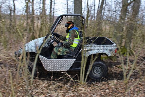 Warchaly, Poland - February 18, 2016: Quad side-by-side Yamaha Rhino 660 driving in the forest. The Yamaha is one of the largest quad producer in the world.