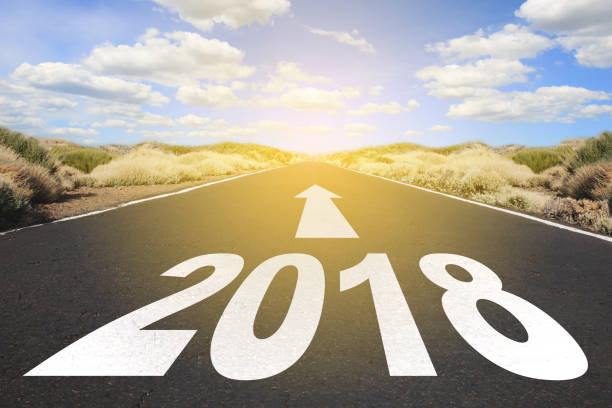istock Empty asphalt road and New year 2018 goals concept - 908729292