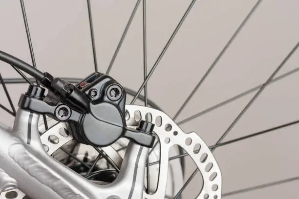 Photo of Hydraulic rear disc brake of mountain bike, close up view