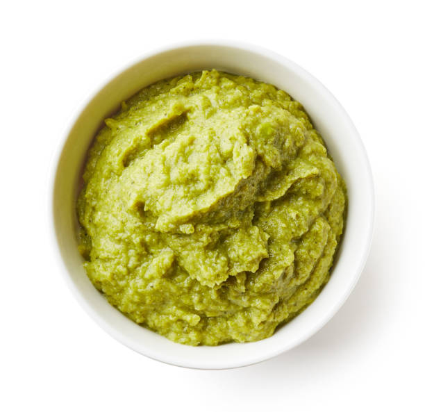 istock Green peas and broccoli baby puree isolated on white 908733834