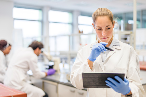 Female scientist working with a digital tablet in the laboratory