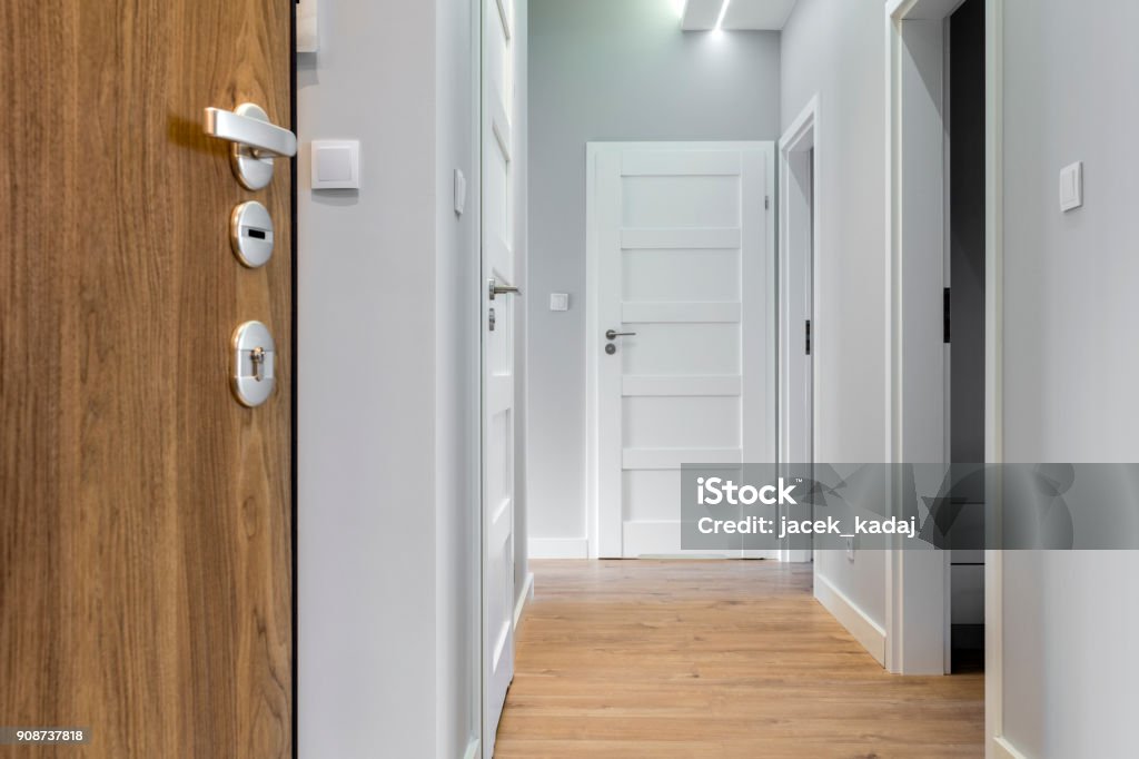 Corridor Corridor with wooden floor in modern apartment Door Stock Photo