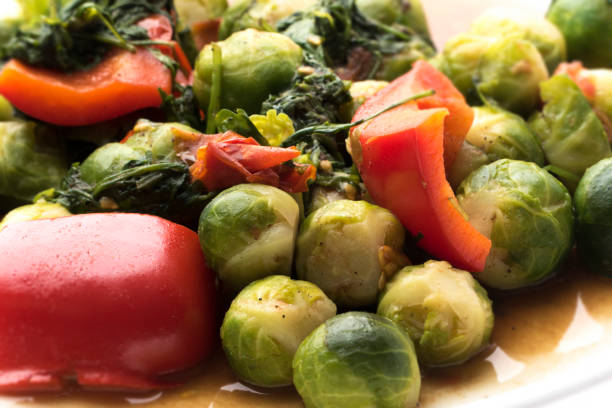 Brussels sprouts on a heart plate on white