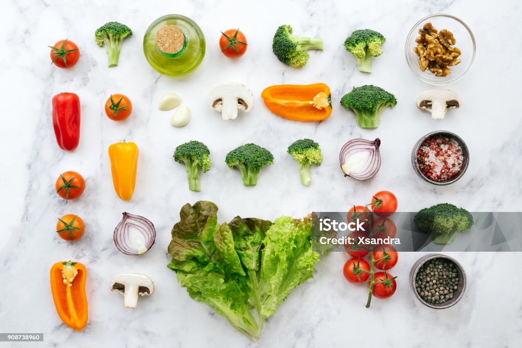 Fresh salad ingredients - knolling concept Organic vegetables on a marble background Vegetable Stock Photo