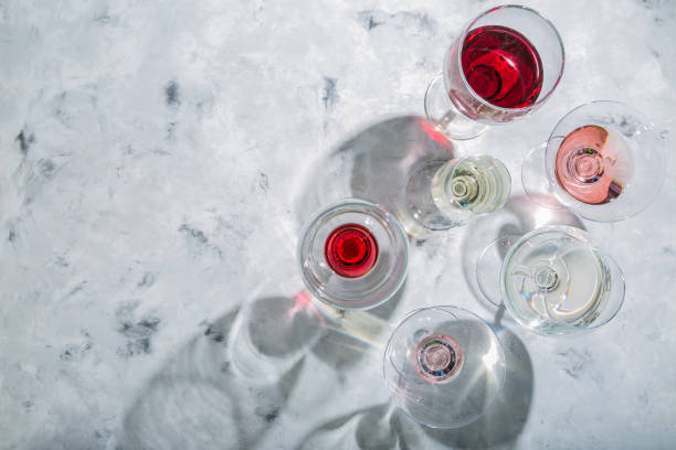 istock Wine tasting concept - glass with different wine on marble background 908745564