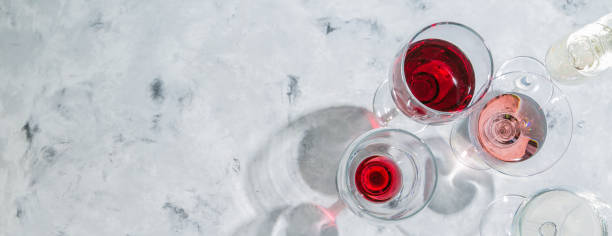 istock Wine tasting concept - glass with different wine on marble background 908745586