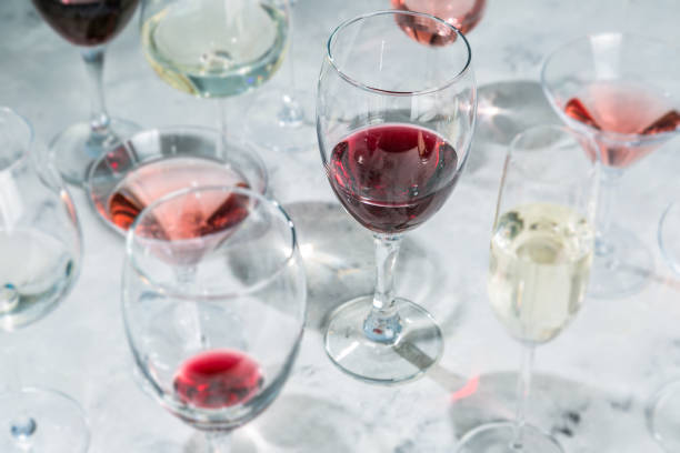 istock Wine tasting concept - glass with different wine on marble background 908745626