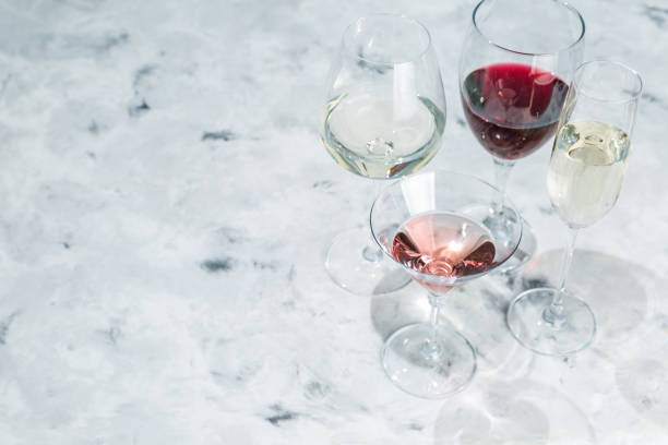 istock Wine tasting concept - glass with different wine on marble background 908745652