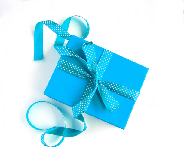 Dark turquoise gift box flat lay on dark turquoise background. Concept present box decoration holiday top view. Copy Space.