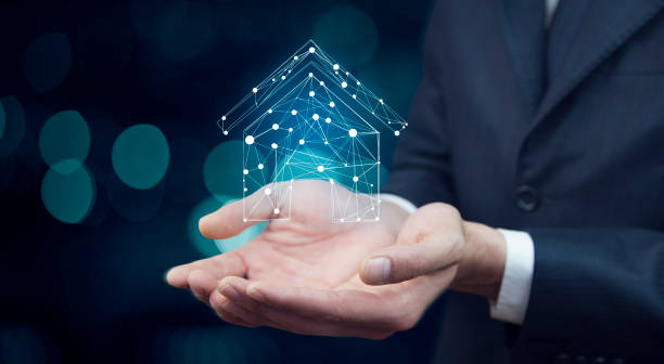 istock house on virtual screen in man hand 908748520