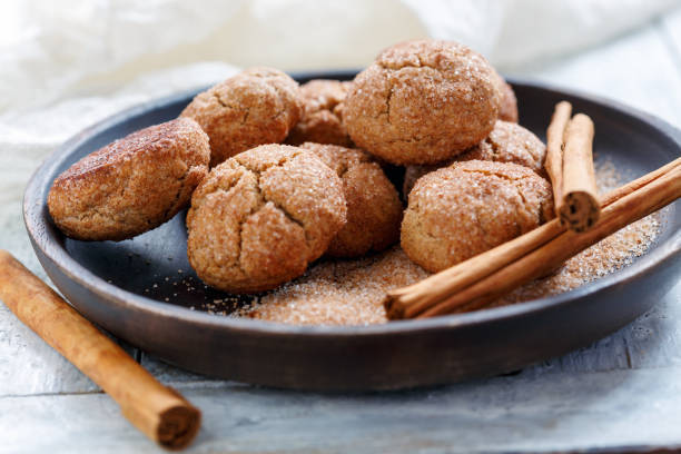 istock Cookies with cinnamon sugar on a wooden platter. 908748758