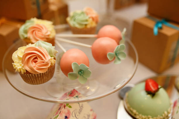istock Cupcake and other sweets on candy bar. Catering service at wedding day 908755606